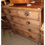 A Regency mahogany chest of drawers, with two short drawers over three graduated long drawers,