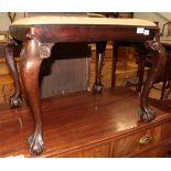 A 1920s stool with claw and ball feet