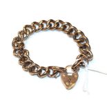 A curb and lock bracelet, each link stamped '9CT', length 23cm . Gross weight 27.7 grams.