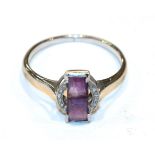 An Art Deco amethyst and diamond ring, finger size O1/2 NB: one diamond deficient . Gross weight 2.2