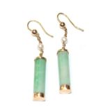 A pair of jade and cultured pearl drop earrings, jade barrels in yellow rubbed over settings chain