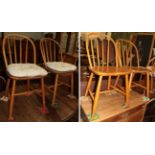 Four beech spindle back chairs, possibly Ercol