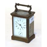 A French brass carriage clock with white enamelled dial