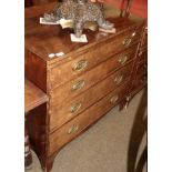 A Regency style mahogany caddy topped chest of drawers, with shaped apron, raised on bracket feet