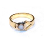 An 18 carat gold opal ring (converted from a tie pin and a wedding band), finger size L. Gross