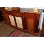 A reproduction mahogany and crossbanded credenza with metal grille doors, 195cm wide In good overall