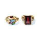 A 9 carat gold garnet, citrine, blue topaz, amethyst and tsavorite garnet ring, finger size N; and a