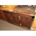 An 18th century oak panelled cupboard, 128cm wide