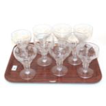 A set of nine 19th century stemmed wine glasses, etched grape and vine design (9)