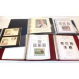 Box containing commemorative stamps: Queen Mother 90/100th birthday issues; two red albums; and