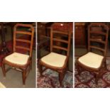 A set of three late 18th century walnut side chairs, possibly Dutch, strung with boxwood, with