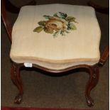 A 19th century walnut dressing stool with overstuffed seat