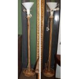 A pair of pine standard lamps, with fluted column supports and circular bases (one repaired)