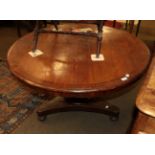 A Victorian mahogany and circular crossbanded breakfast table