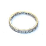 A diamond eternity ring, unmarked, finger size J1/2. Gross weight 2.1 grams