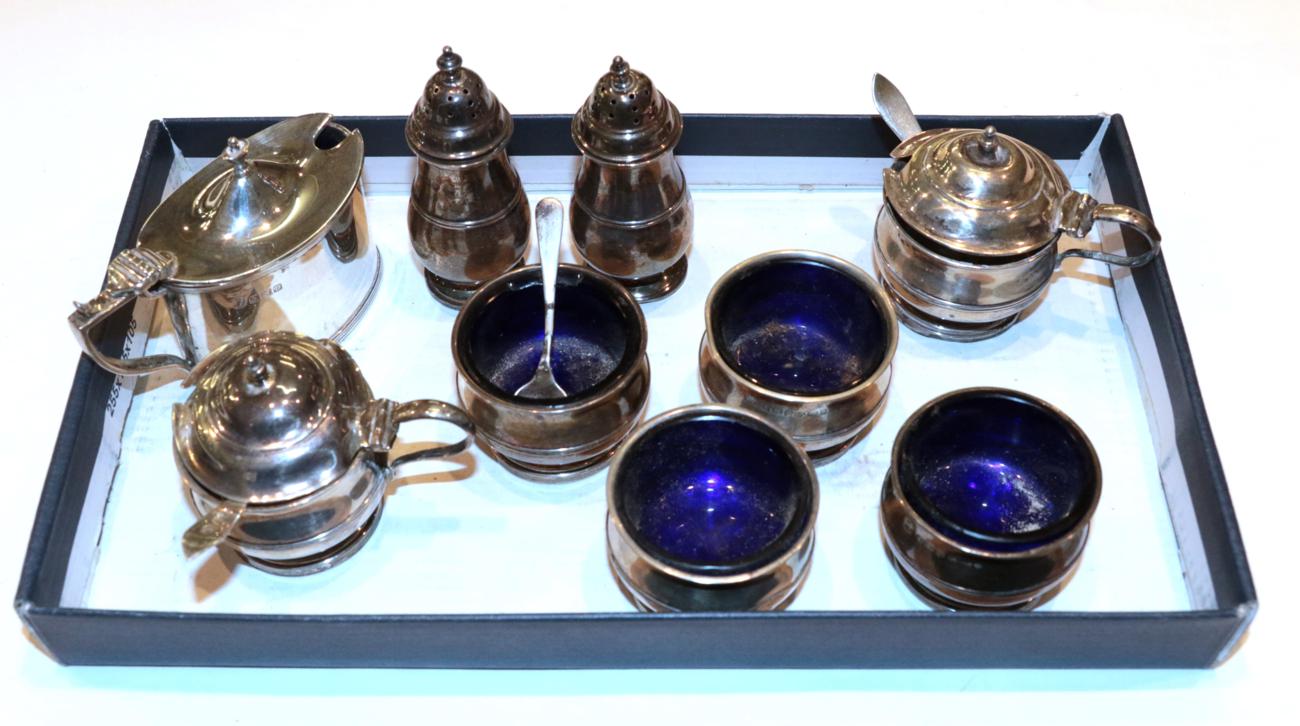 An eight-piece George V silver condiment-set, by Adie Brothers, Birmingham, 1927, one pepperette