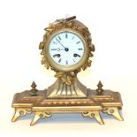 A gilt metal striking mantel clock, retailed by Wheatley, Carlisle
