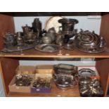 A large quantity of silver plated wares including wine-cooler, teapots, trays, meat dishes, fiddle