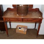 A 19th century mahogany washstand, with shaped gallery above two drawers, raised on octagonal