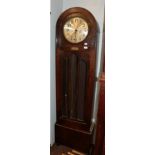 An Art Deco quarter chiming longcase clock, oak veneered case with arched pediment and an applied