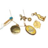 A locket stamped '14K'; a locket stamped '585'; a pendant and matching brooch, stamped '14K';