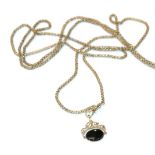 A guard chain, with applied plaque stamped '9CT'; and a 9 carat gold onyx swivel fob. Gross weight