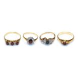 A 9 carat gold garnet solitaire ring, finger size X1/2; a garnet and diamond cluster ring,