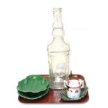 A reproduction Leeds ware matrimony mug; Victorian Wedgwood leaf dishes; a bar top decanter in the