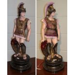 A pair of reproduction painted plaster models of centurions
