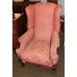 A 1920s wing back armchair