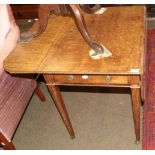 A Regency mahogany and crossbanded Pembroke table, on square tapering legs with brass caps and