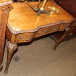 An early 20th century serpentine fronted side table, raised on cabriole legs, 76.5cm by 101cm