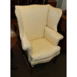 A 19th century wing back chair on square fluted legs, 77cm wide
