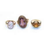 A cameo ring, unmarked, finger size K; a 9 carat gold amethyst and seed pearl ring, out of shape;
