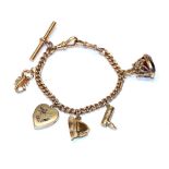 A charm bracelet, each link stamped '9' and '.375', hung with six charms including a scorpion, a