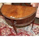 A mid 19th century mahogany demi lune side table with raised brass gallery, tambour fronted