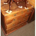 A pine chest made of reclaimed timber, with rounded corners flanking an arrangement of four