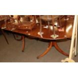 An early 20th century mahogany twin pedestal dining table with one additional leaf, 208cm fully