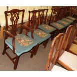 A harlequin set of seven mahogany Chippendale style dining chairs, with carved backs, raised on