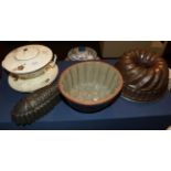 A 19th century Creamware ecuelle; and three moulds (4)