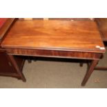 A 19th century mahogany fold over tea table