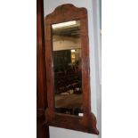 A leather framed mirror, late 19th century, with rectangular mirror plate, the border decorated with