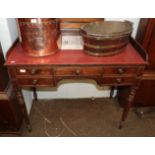 A mid 19th century oak dressing table with raised gallery and turned tapering legs