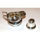 A George III silver cream-jug and a George V silver inkwell, the first by Robert and Samuel Hennell,