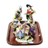 A pair of Sitzendorf figures of a lady and gentleman; a Sitzendorf figure group of dancers; and a