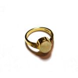 An 18 carat gold opal ring, finger size Q. Gross weight 6.1 grams.