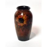 A Walter Moorcroft flambé Anemone design vase, impressed factory marks and POTTER TO H.M. THE QUEEN,