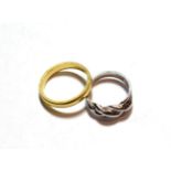 A 9 carat white gold twist ring, finger size L; and an 18 carat gold band ring, finger size Q. 9