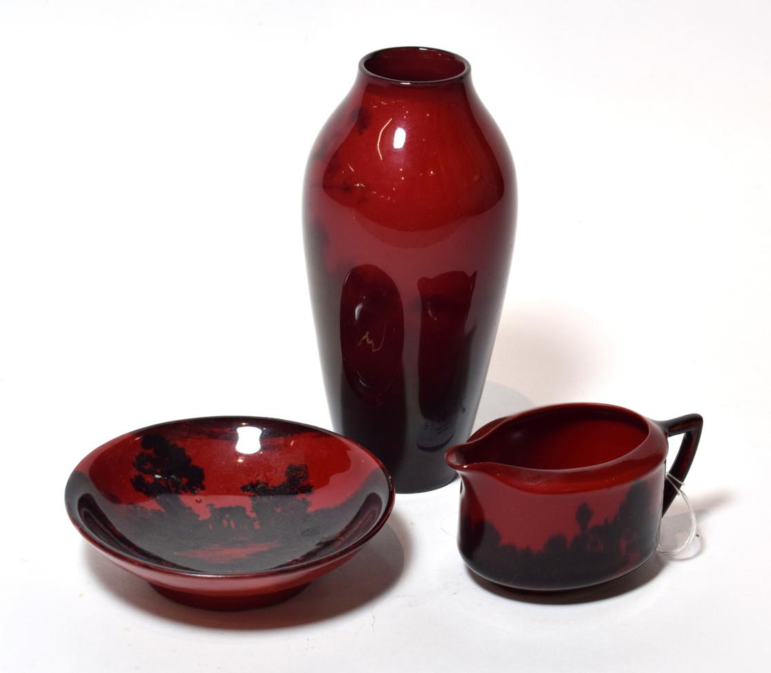 A Royal Doulton Flambe vase, together with a further flambe jug and bowl (3)