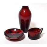 A Royal Doulton Flambe vase, together with a further flambe jug and bowl (3)